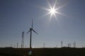 The sun shines on the electric windmill on the mountain Royalty Free Stock Photo