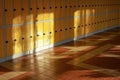 Sun shines on empty elementary school hall, numbered lockers at the wall Royalty Free Stock Photo