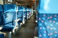 Sun shines on empty seats in train, abstract rail travel concept with shallow depth of field photo only few chairs focus
