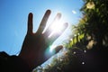 The sun shines through the gaps in the hands Royalty Free Stock Photo