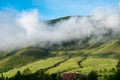 The sun shines on the misty mountains in the early morning Royalty Free Stock Photo