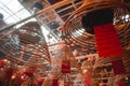 Sun shining through buddhist spiral burning sticks in a temple in Hong Kong China