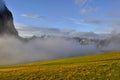 The sun is shining after heavy rain. Clouds in the valley. Royalty Free Stock Photo