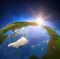 Sun shining over North Pole from space Royalty Free Stock Photo