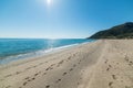 Sun shining over Perdepera beach on a summer day Royalty Free Stock Photo