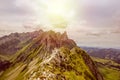 The sun shining on the steep ridge of the Majestic Schaefler peak in the Alpstein mountain range around the Aescher cliff in