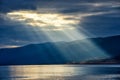 Sun shining through thick cloudy sky, silver lining Royalty Free Stock Photo