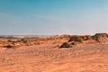 Sunny Serenity: Rocky Landscape and Mountains in the Desert on a Peaceful Afternoon