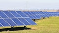 Sun and solar panels in a field. Solar energy power plant. Industrial and ecological concept for nature and eco / green technology Royalty Free Stock Photo