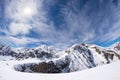 Sun star glowing over snowcapped mountain range, italian Alps Royalty Free Stock Photo