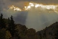 Sun streaks rays of light over mountains in the Smoky Mountains.