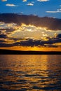 Sun Streams in Rays Through Clouds During Sunset in Wawheap Bay at Lake Powell Royalty Free Stock Photo