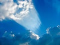 Sun striking through the clouds like a searchlight Royalty Free Stock Photo