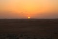 Sun at sunset that colors the dunes in the Omani desert, Wahiba Sands / Sharqiya Sands, Oman Royalty Free Stock Photo