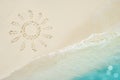 Sun symbol drawing on tropical sand beach near blue sea Royalty Free Stock Photo