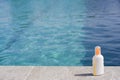 Sun tan lotion poolside Royalty Free Stock Photo