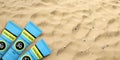 Sunscreen, sun protection lotion on sandy beach background, copy space. 3d illustration