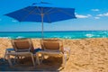 Sun umbrella and beach beds on tropical sandy beach, Tropical destinations. Cancun, Mexico. Mexico Royalty Free Stock Photo