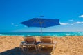 Sun umbrella and beach beds on tropical sandy beach, Tropical destinations. Cancun, Mexico. Mexico Royalty Free Stock Photo