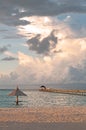 Sun umbrella and pier at the ocean