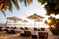 Sun umbrellas and beach chairs on tropical beach Royalty Free Stock Photo