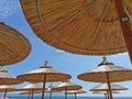 Sun umbrellas with blue sky on beach Royalty Free Stock Photo