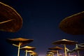 Sun umbrellas during starry night in Vama Veche beach Royalty Free Stock Photo