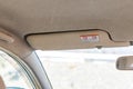 Sun visor in a vehicle with warning sign Royalty Free Stock Photo