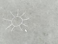 Sun - white chalk hand drawing on black asphalt Royalty Free Stock Photo