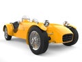 Sun yellow vintage open wheel sports racing car - closeup shot Royalty Free Stock Photo