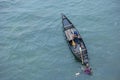 Sunamganj, Bangaldesh- October 11,2016:One kid standing on boat and another kid dragging the boat to the shore