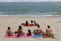 Sunbath in Arpoador Beach in Rio de Janeiro