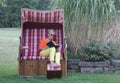 Sunbathe in the roofed wicker beach chair and read an exciting book, so you can spend the holiday