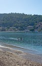 Sunbathers on a sandy beach