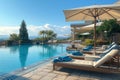 Sunbathing area with loungers and umbrellas near a pool