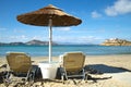 Sunbathing chairs on a beach in Greece Royalty Free Stock Photo