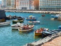 Sunbathing in fishing boats of Borgo Marinari. Naples. Italy. Royalty Free Stock Photo