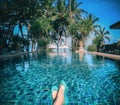 Sunbathing by the hotel tourist resort swimming poo Royalty Free Stock Photo