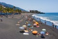 Sunbathing people at beach La Palma Island, Spain