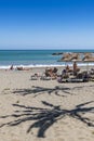 Sunbathing people Plaza beach Puerto BanÃÂºs Spain Royalty Free Stock Photo