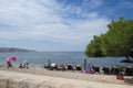 Sunbathing people on the seafront