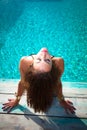 Sunbathing by the pool Royalty Free Stock Photo