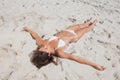 Sunbathing woman lying on beach