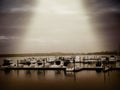 Sunbeam Over A Boat Harbor