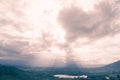 Sunbeam over lake and mountain in Khao Kho District Royalty Free Stock Photo