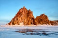 Sunbeam over Shamanka Rock near Khuzhir in late winter in evening sunset time. Royalty Free Stock Photo