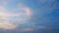 Sunbeam shining through sunset sky in summer sunshine evening. Beautiful sky with cirrocumulus clouds background