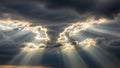 Sunbeams breaking through dark storm clouds in a dramatic sky sunlight Royalty Free Stock Photo