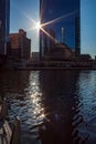 Sunbeams extend over the Chicago River and cast tiny beam of lights onto the water ripples Royalty Free Stock Photo
