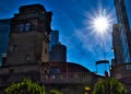 Sunbeams extend over Chicago Riverwalk and runner arriving up a staircase to LaSalle Street and Wacker Drive.